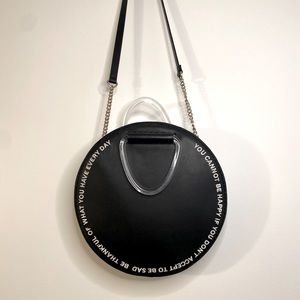 circular embroidered faux leather bag